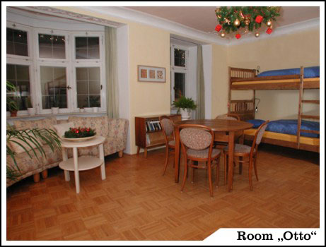 Otto’s colourful six-person room with wooden bunk beds